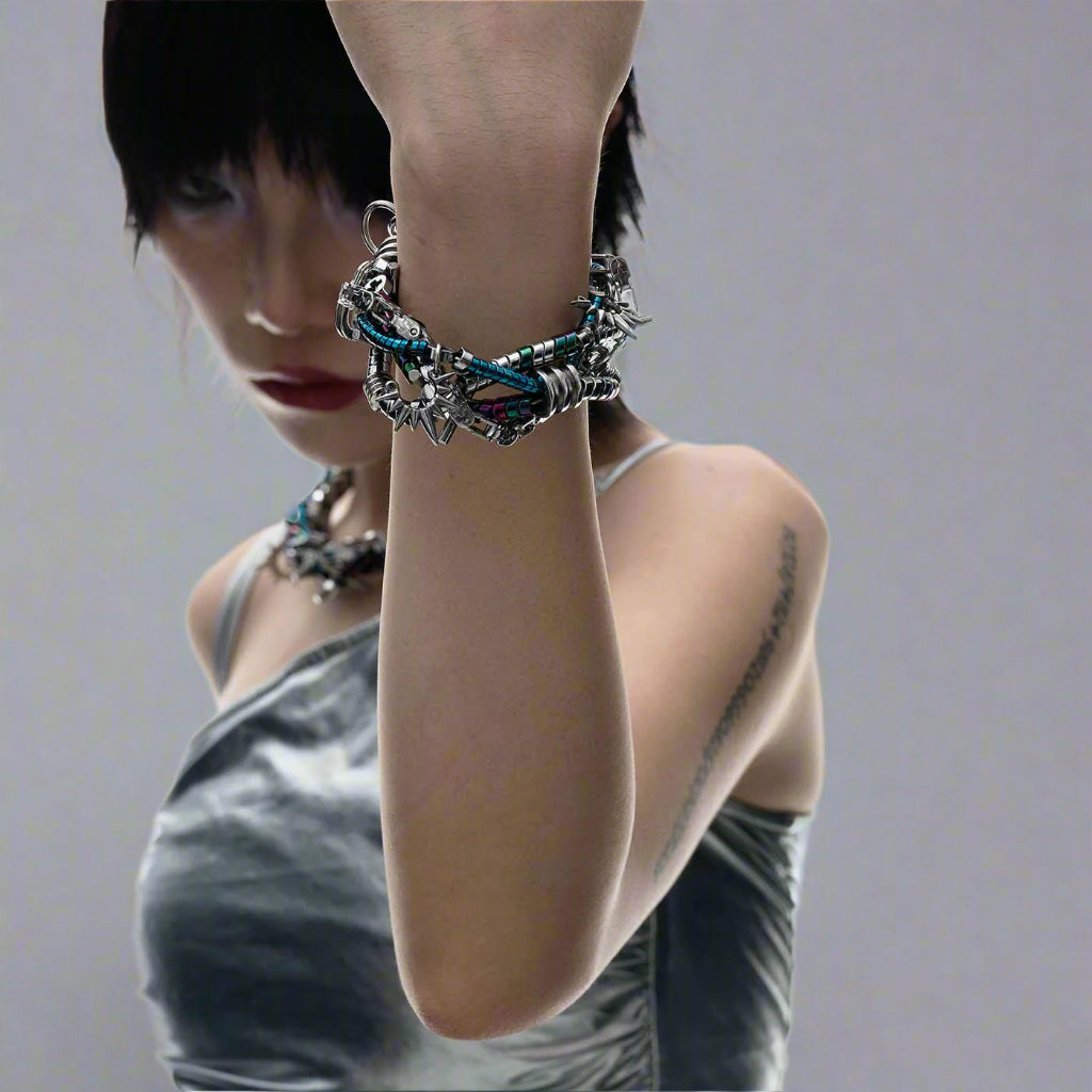 Person wearing a colorful bracelet on a white background